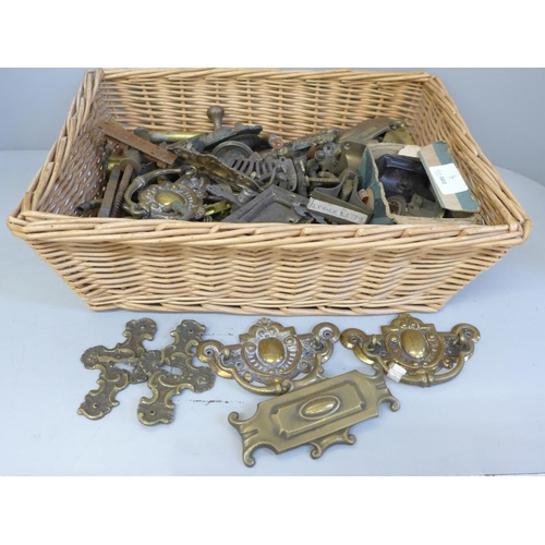 741 - A box of door furniture, brass escutcheons, lock, etc.