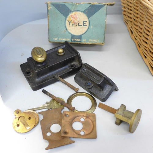 741 - A box of door furniture, brass escutcheons, lock, etc.