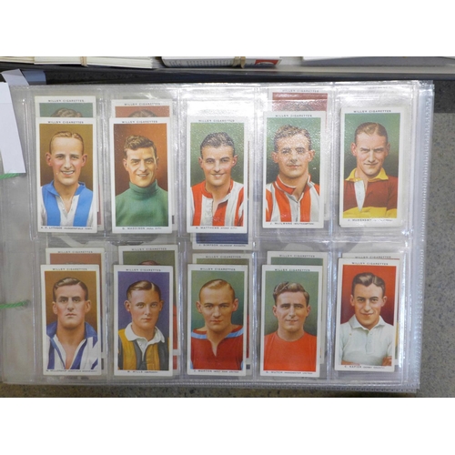 746 - A large collection of cigarette cards and tea cards in two trays, covering many themes, cards in set... 