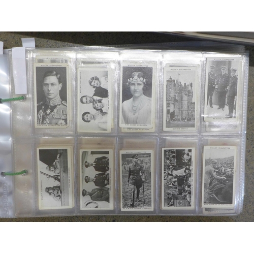 746 - A large collection of cigarette cards and tea cards in two trays, covering many themes, cards in set... 