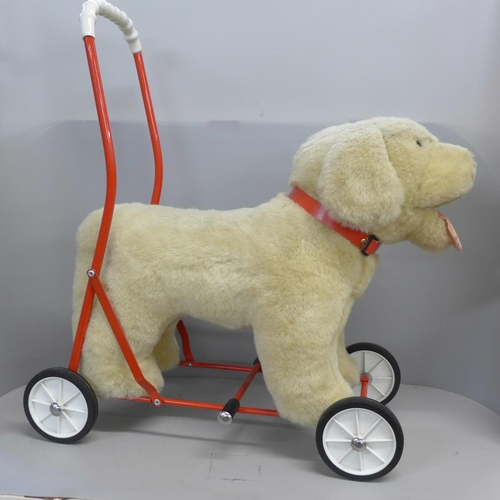 759 - Three Harrods teddy bears, 2000, 20001 and 2015 and a Mulholland & Bailic Labrador on wheels