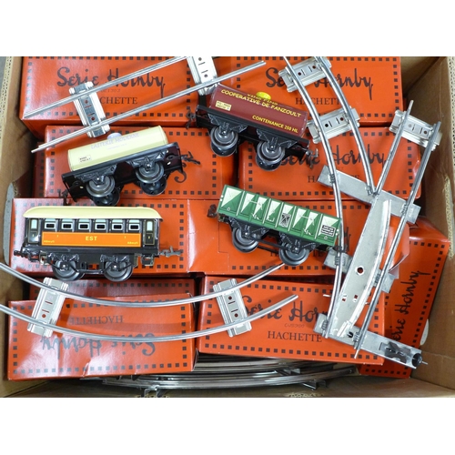 775 - Twenty-six French issue Hachette Reproductions 'Series Hornby' O gauge wagons, coaches and track