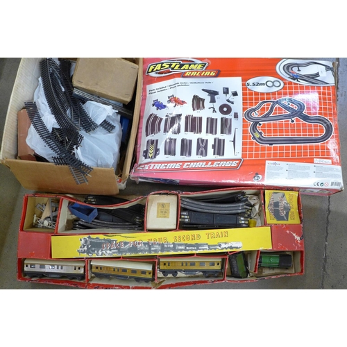 780 - A Fastlane Racing Extreme Challenge racing set, a Twin Trix Railway 00 gauge train set, boxed and ot... 