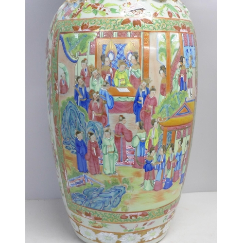 786 - A 19th Century Chinese export famille rose baluster vase, decorated with panels of enamelled figures... 