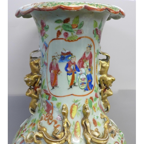 786 - A 19th Century Chinese export famille rose baluster vase, decorated with panels of enamelled figures... 