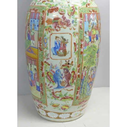 786 - A 19th Century Chinese export famille rose baluster vase, decorated with panels of enamelled figures... 