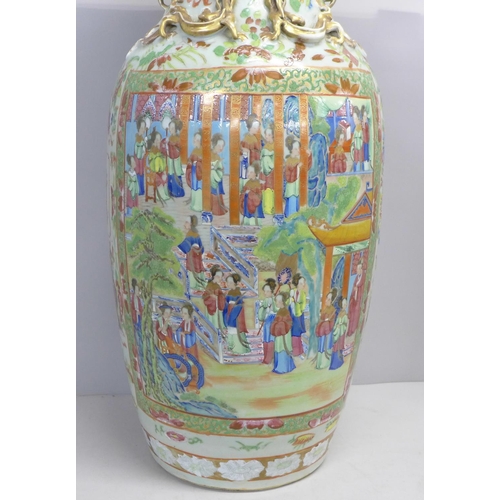 786 - A 19th Century Chinese export famille rose baluster vase, decorated with panels of enamelled figures... 