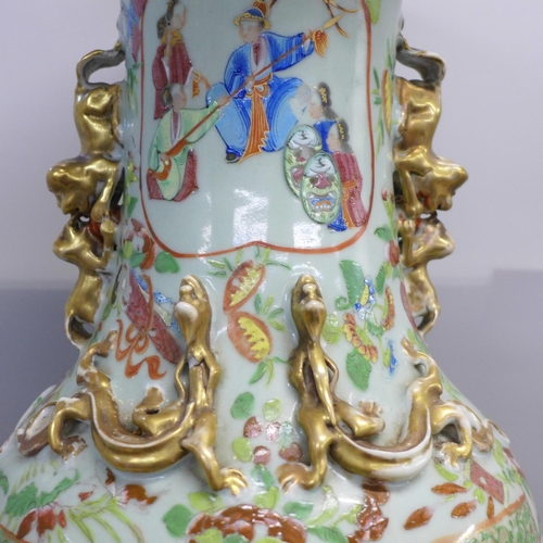 786 - A 19th Century Chinese export famille rose baluster vase, decorated with panels of enamelled figures... 