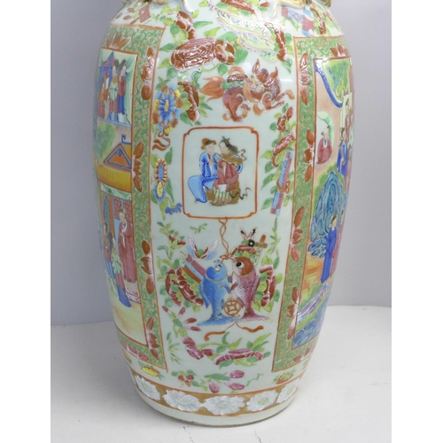 786 - A 19th Century Chinese export famille rose baluster vase, decorated with panels of enamelled figures... 