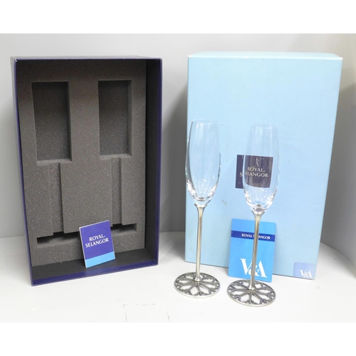 795 - A pair of Royal Selangor The Victoria and Albert Museum champagne flutes, boxed, 28cm