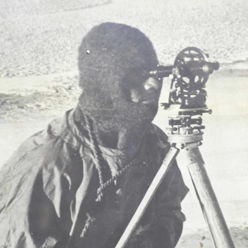 796 - An oak framed photograph of a Polar explorer - Captain Evans observing with the theodolite used by C... 