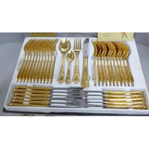 808 - A Solingen canteen of cutlery, gold tone