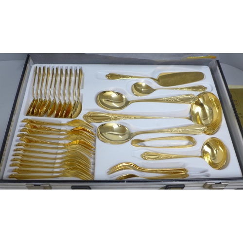 808 - A Solingen canteen of cutlery, gold tone