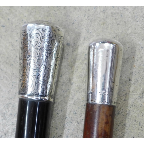 817 - A Victorian silver topped and ebonised walking cane and one other silver topped walking cane