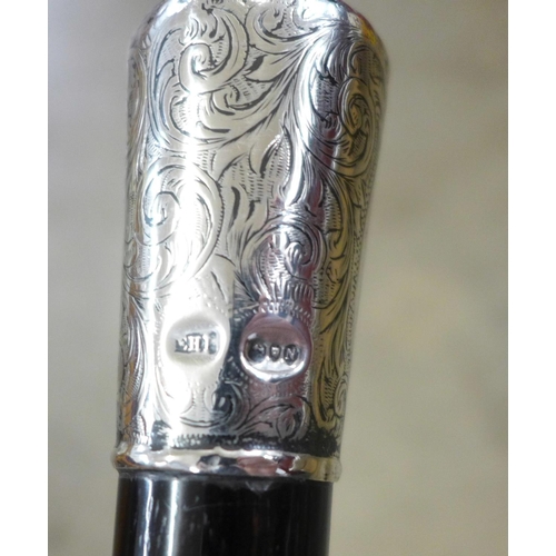 817 - A Victorian silver topped and ebonised walking cane and one other silver topped walking cane