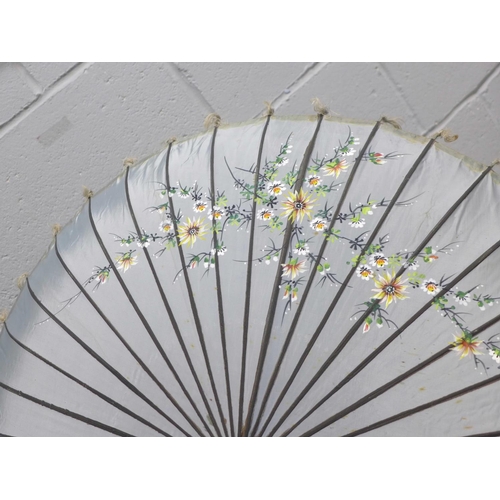 819 - A Japanese silk parasol in original tin-plate container