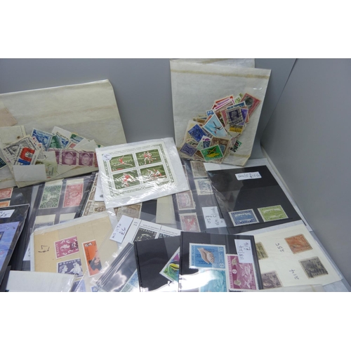 822 - A collection of stamps on stockcards and in packets