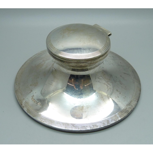 845 - A silver Capstan inkwell, Sheffield 1909, base 148mm