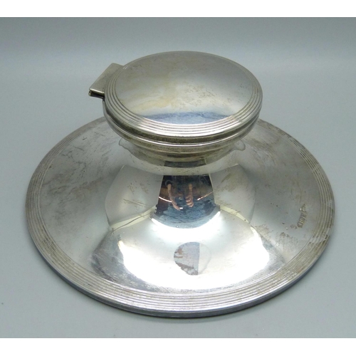 845 - A silver Capstan inkwell, Sheffield 1909, base 148mm