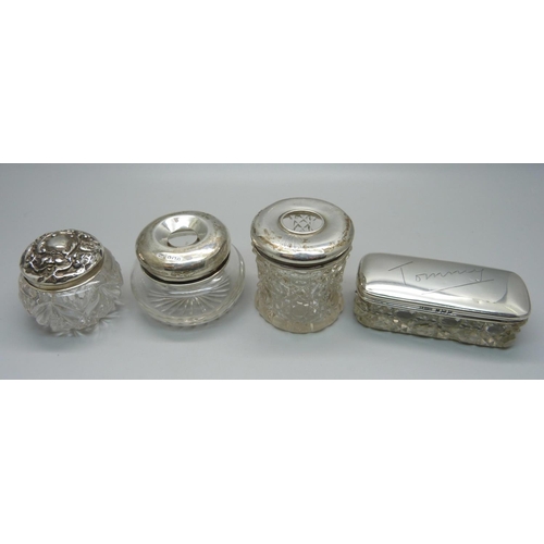 846 - Four silver top glass jars