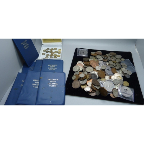 858 - A collection of British coins including half-crowns, commemorative coins, pre-1947 half-silver coins... 