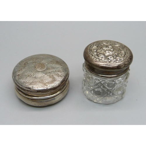 860 - A silver pill box and a silver topped glass jar, 15g of silver