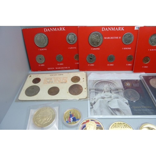 865 - A collection of commemorative coins including gold plated, 1965 British proof set, a Queen Victoria ... 