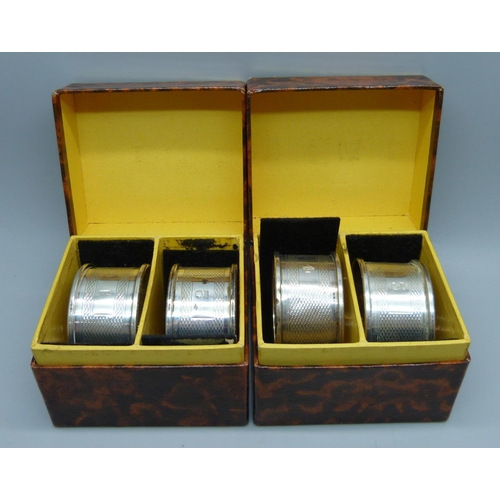 872 - A set of four silver napkin rings, numbered 1-4, Birmingham 1956, 48g