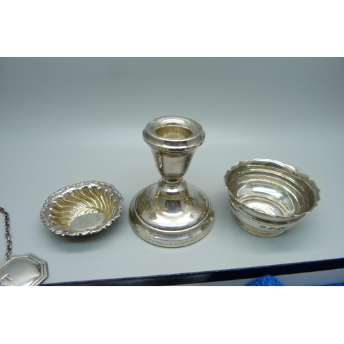 873 - Five silver items; Port label, two salts, candlestick and small silver handled server, weighable sil... 