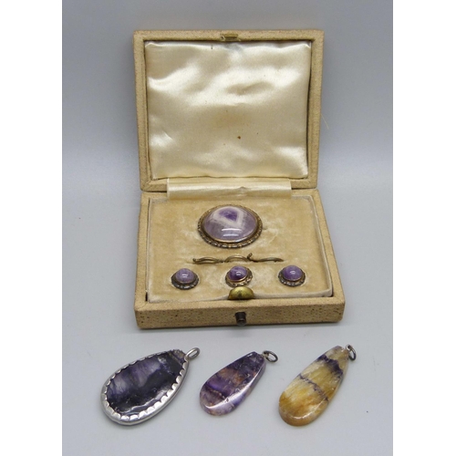 879 - A silver and Blue John brooch and button set, boxed, and three Blue John pendants