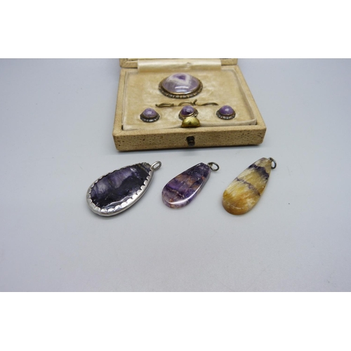 879 - A silver and Blue John brooch and button set, boxed, and three Blue John pendants