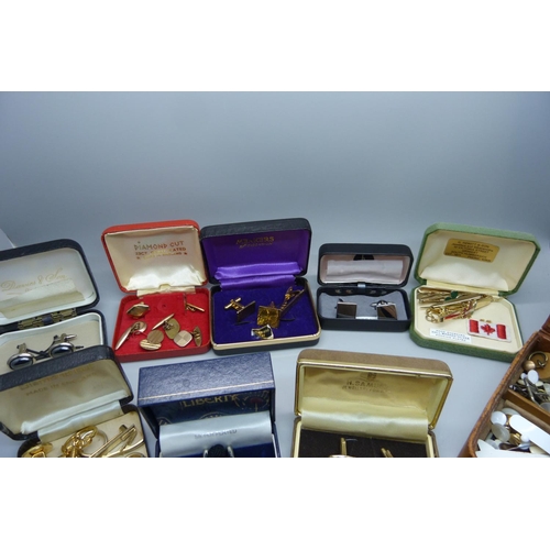 897 - A large collection of cufflinks and tie-pins