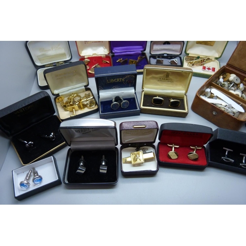 897 - A large collection of cufflinks and tie-pins