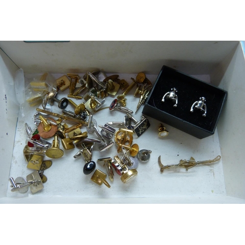 897 - A large collection of cufflinks and tie-pins