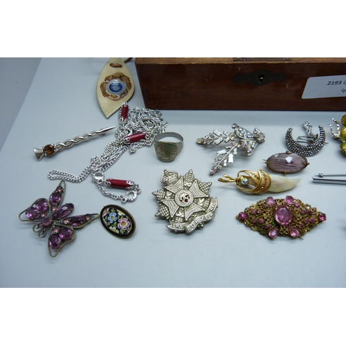 903 - Costume jewellery, cufflinks, a 'The Border Regiment' badge, etc.