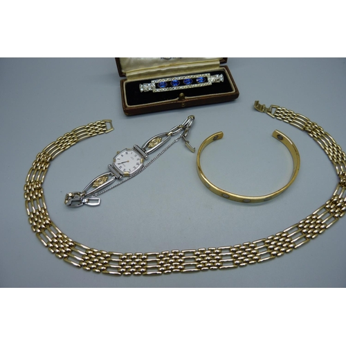 916 - A lady's Citizen quartz wristwatch, an Art Deco brooch, cased (one stone loose), a gold-tone necklac... 