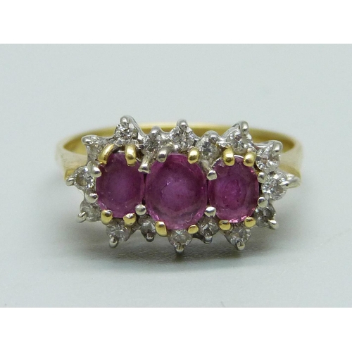 919 - An 18ct gold, ruby and diamond ring, 4.1g, J/K