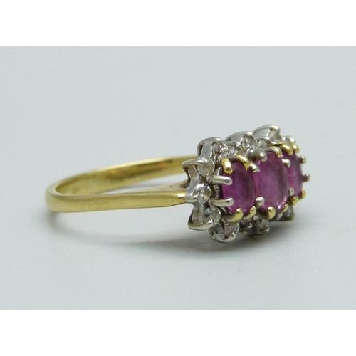 919 - An 18ct gold, ruby and diamond ring, 4.1g, J/K