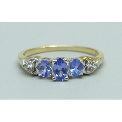 920 - A silver gilt tanzanite and zircon ring, P