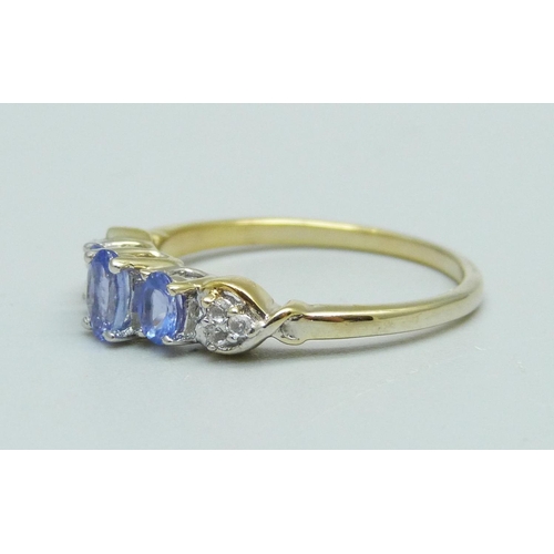 920 - A silver gilt tanzanite and zircon ring, P