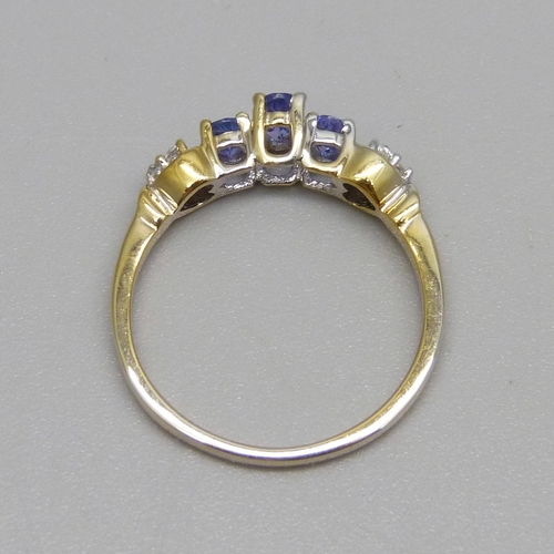 920 - A silver gilt tanzanite and zircon ring, P