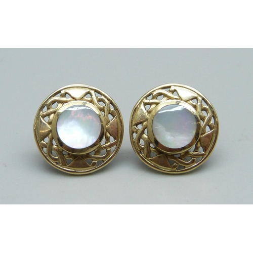 924 - A pair of hallmarked 9ct gold and mother of pearl Celtic design ear studs, 3.9g