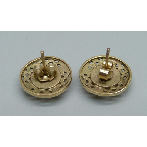 924 - A pair of hallmarked 9ct gold and mother of pearl Celtic design ear studs, 3.9g