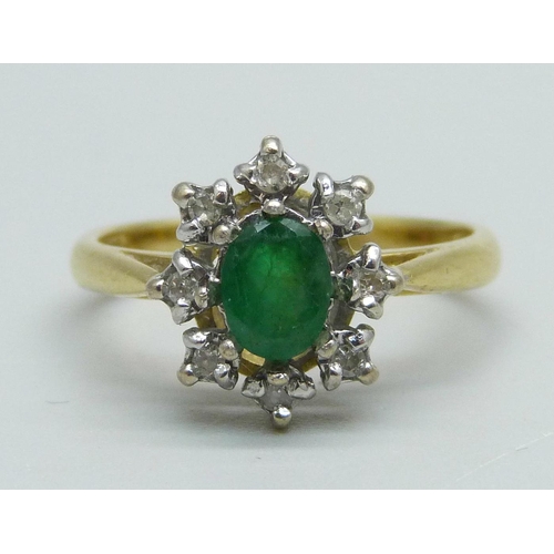 929 - An 18ct gold, emerald and diamond cluster ring, 4.3g, N/O