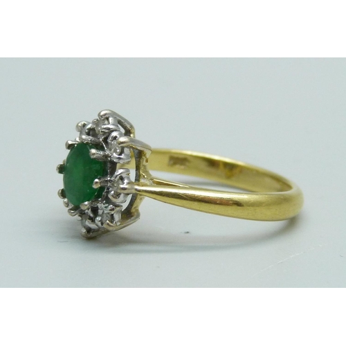 929 - An 18ct gold, emerald and diamond cluster ring, 4.3g, N/O