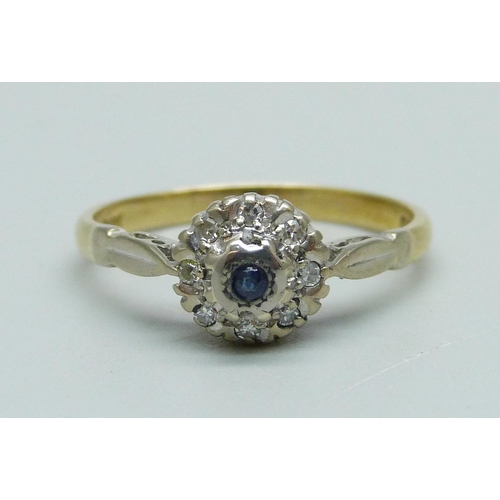 933 - An 18ct gold, sapphire and diamond cluster ring, 2.8g, M/N