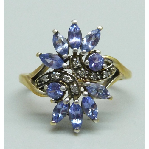 935 - A tanzanite and diamond cocktail cluster ring, marked 9K, 3.4g, O/P