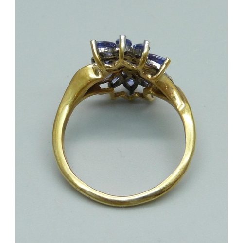 935 - A tanzanite and diamond cocktail cluster ring, marked 9K, 3.4g, O/P