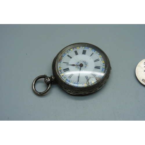 939 - A silver pocket watch, 4cm case, and two gold fronted silver fob medals