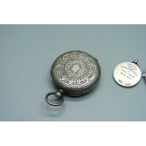 939 - A silver pocket watch, 4cm case, and two gold fronted silver fob medals